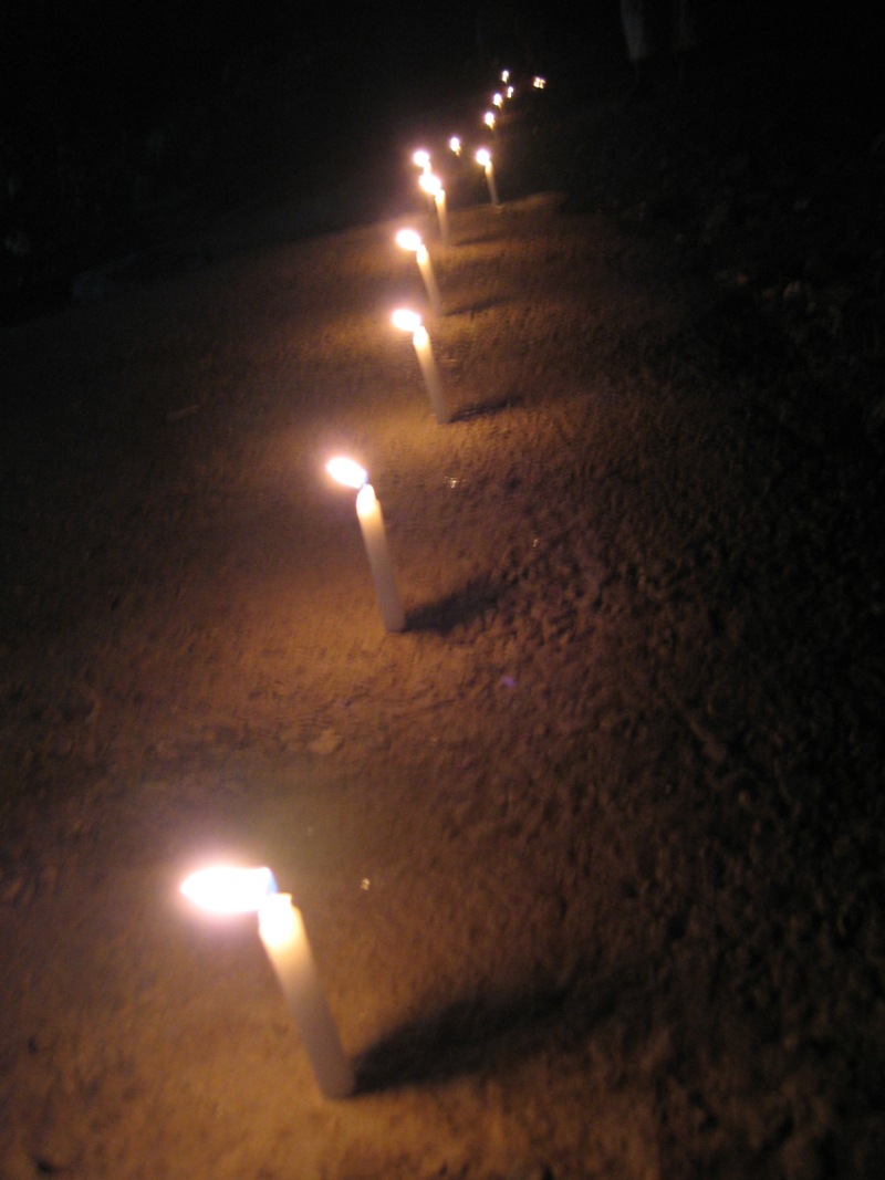 Candles commemorate Santa Cruz massacre.