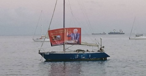 Protest boat in Dili harbor across from Government Palace. Photo from Tempo Timor. 